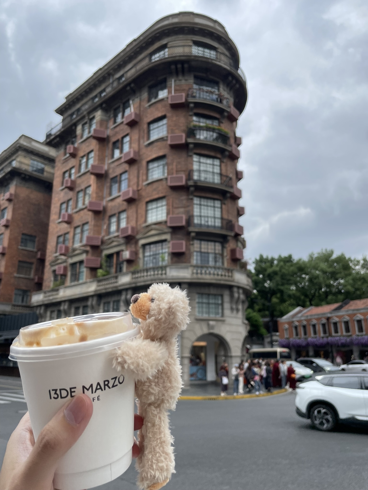 Tree-canopied Wukang Road with heritage architecture in Shanghai, China.