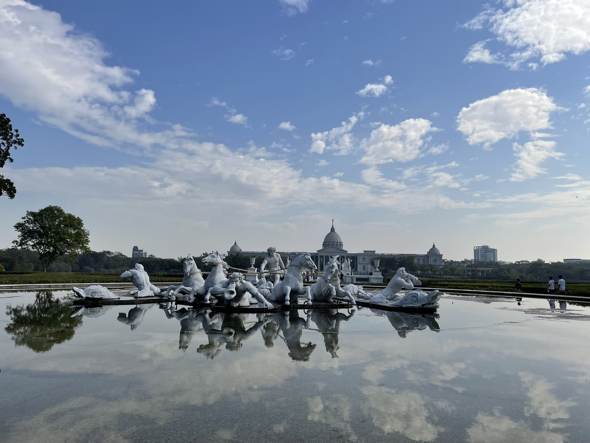 Neoclassical facade of Chimei Museum reflected in its grand fountain in Tainan, Taiwan.
