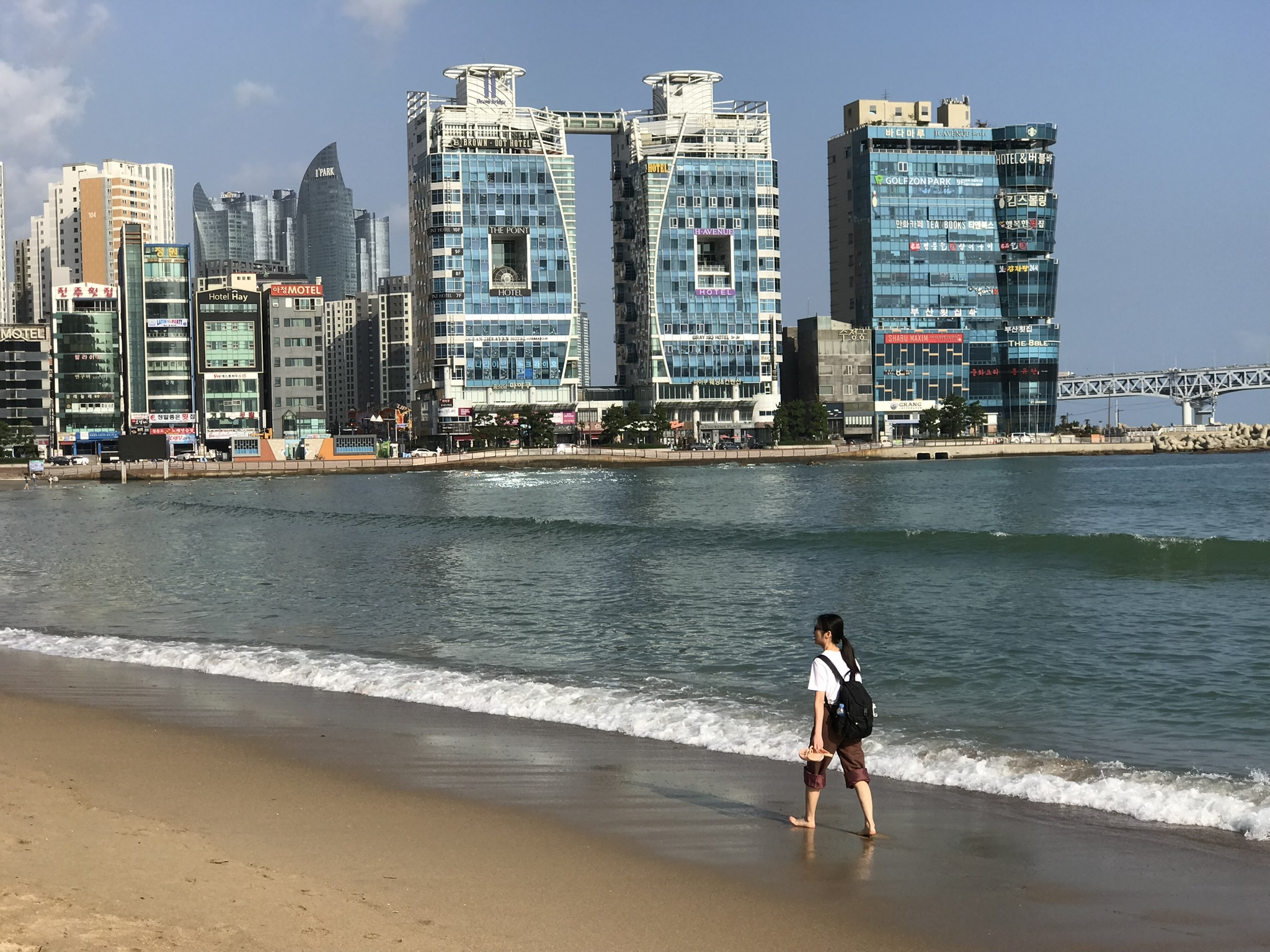 Sandy shoreline and ocean view at Haeundae Beach in Busan, South Korea.