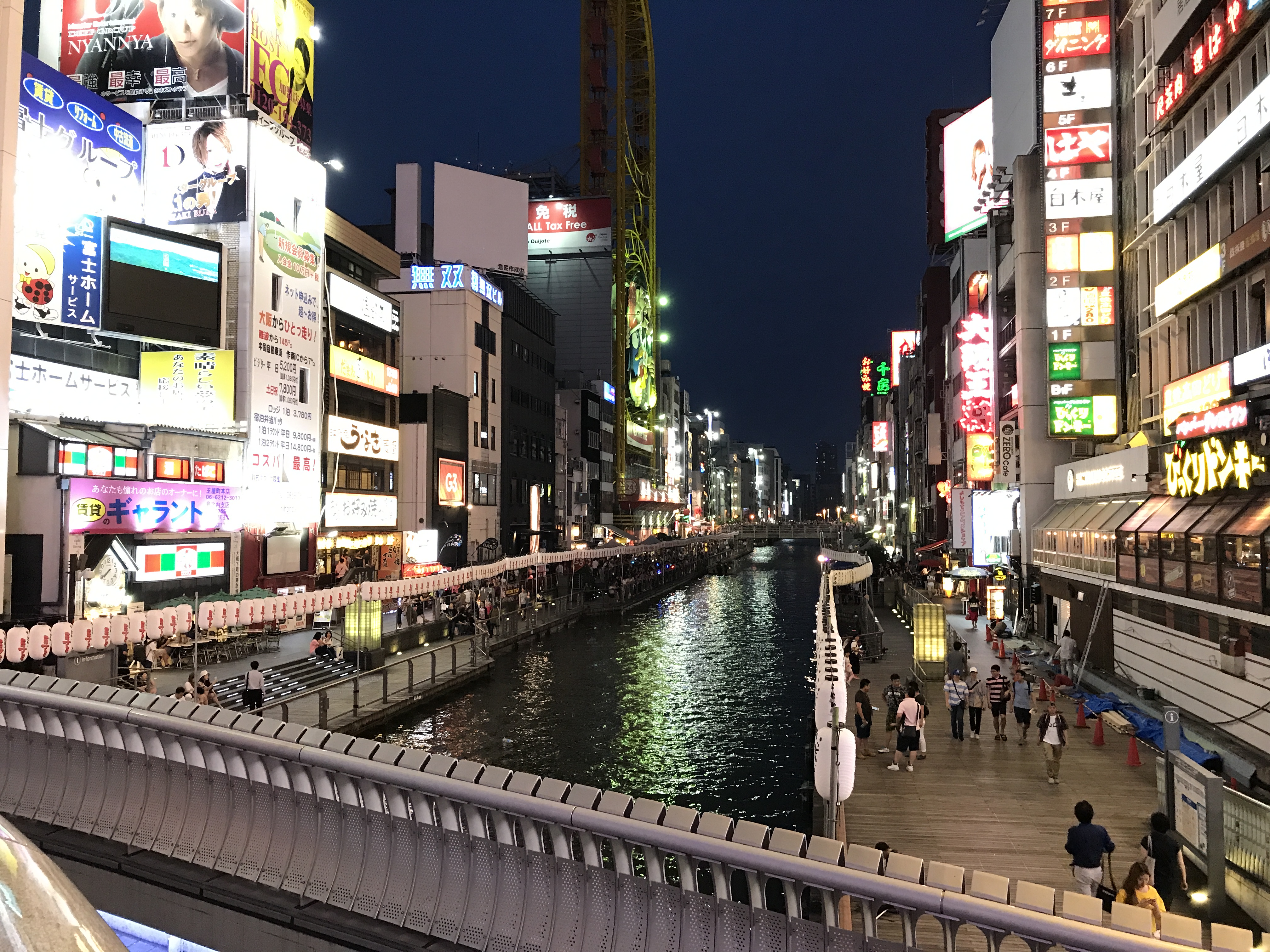 The vibrant neon-lit Dotonbori canal district in Osaka, Japan.