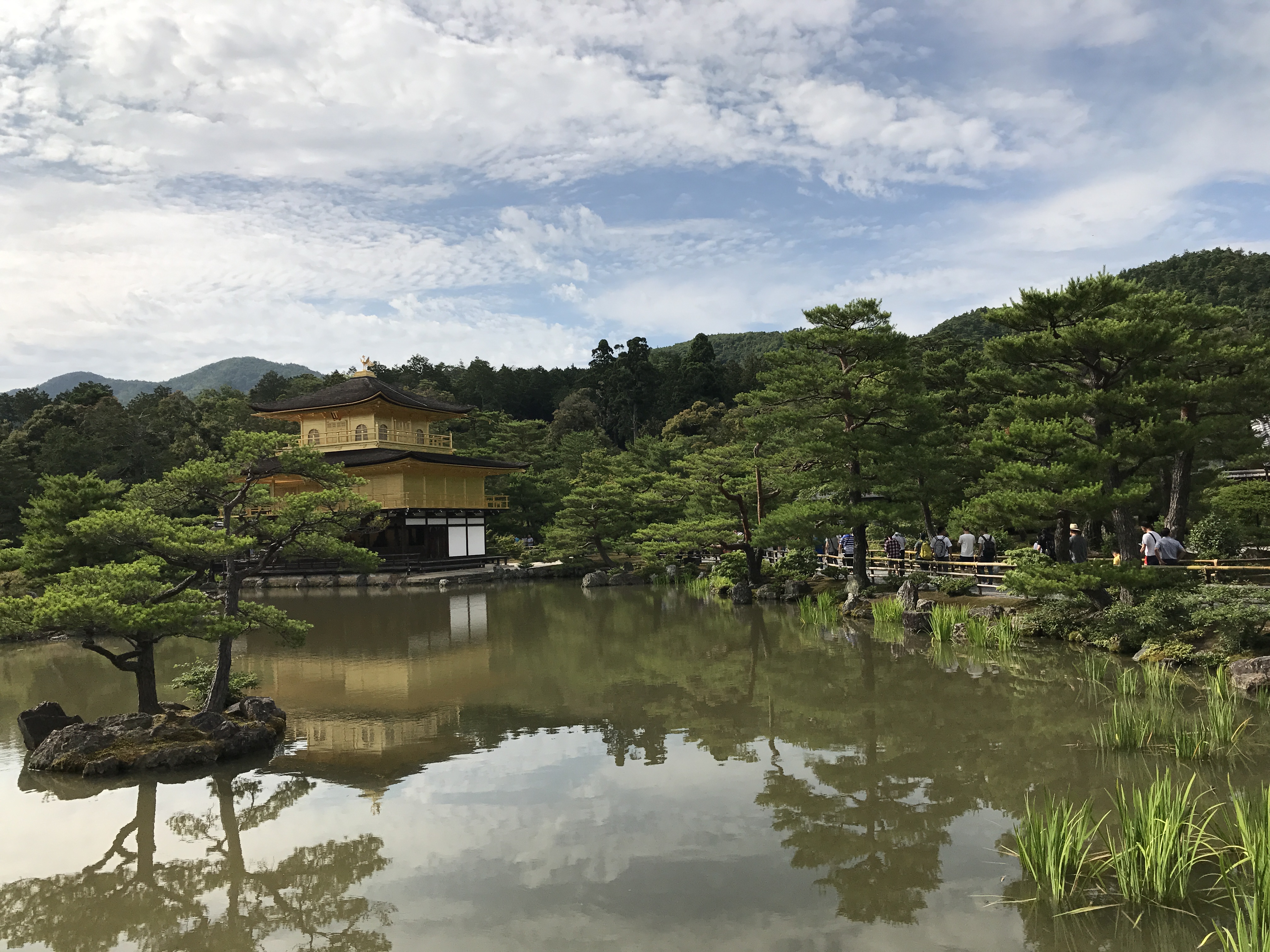 The golden pavilion of Kinkaku-ji reflected on still water in Kyoto, Japan.